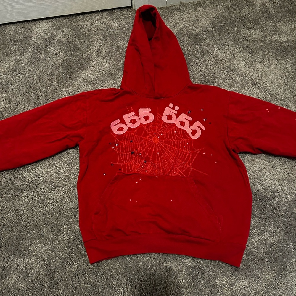 This is a spider hoodie it is red pink